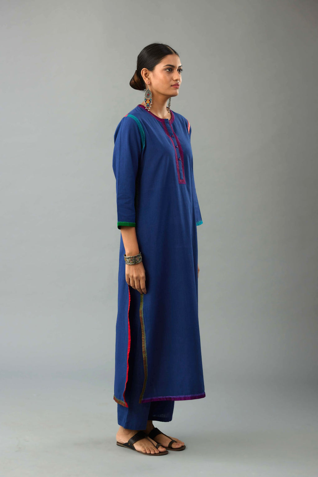 Blue handloom cotton straight kurta set with multi colored silk facings and embroidery detail.