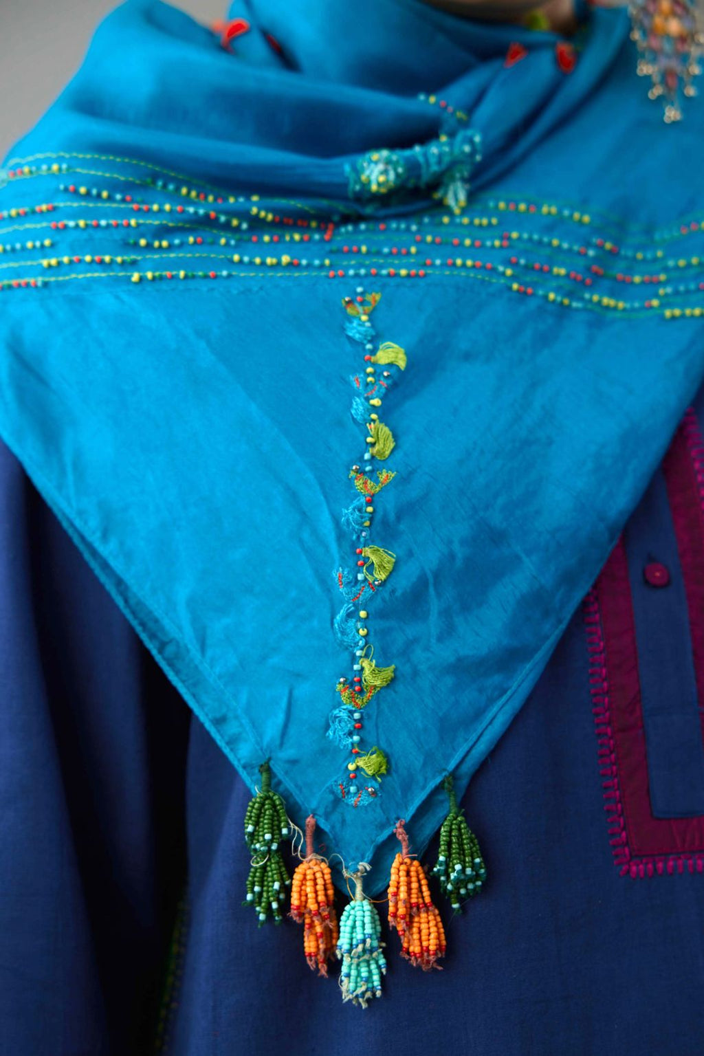 Turquoise blue square scarf with contrasting bird and tassel embroidery