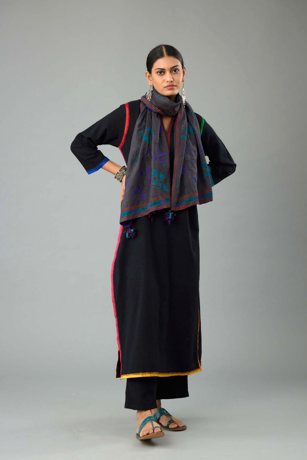 Black handloom cotton straight kurta with slit neck, multi colored silk facings and embroidery detail.