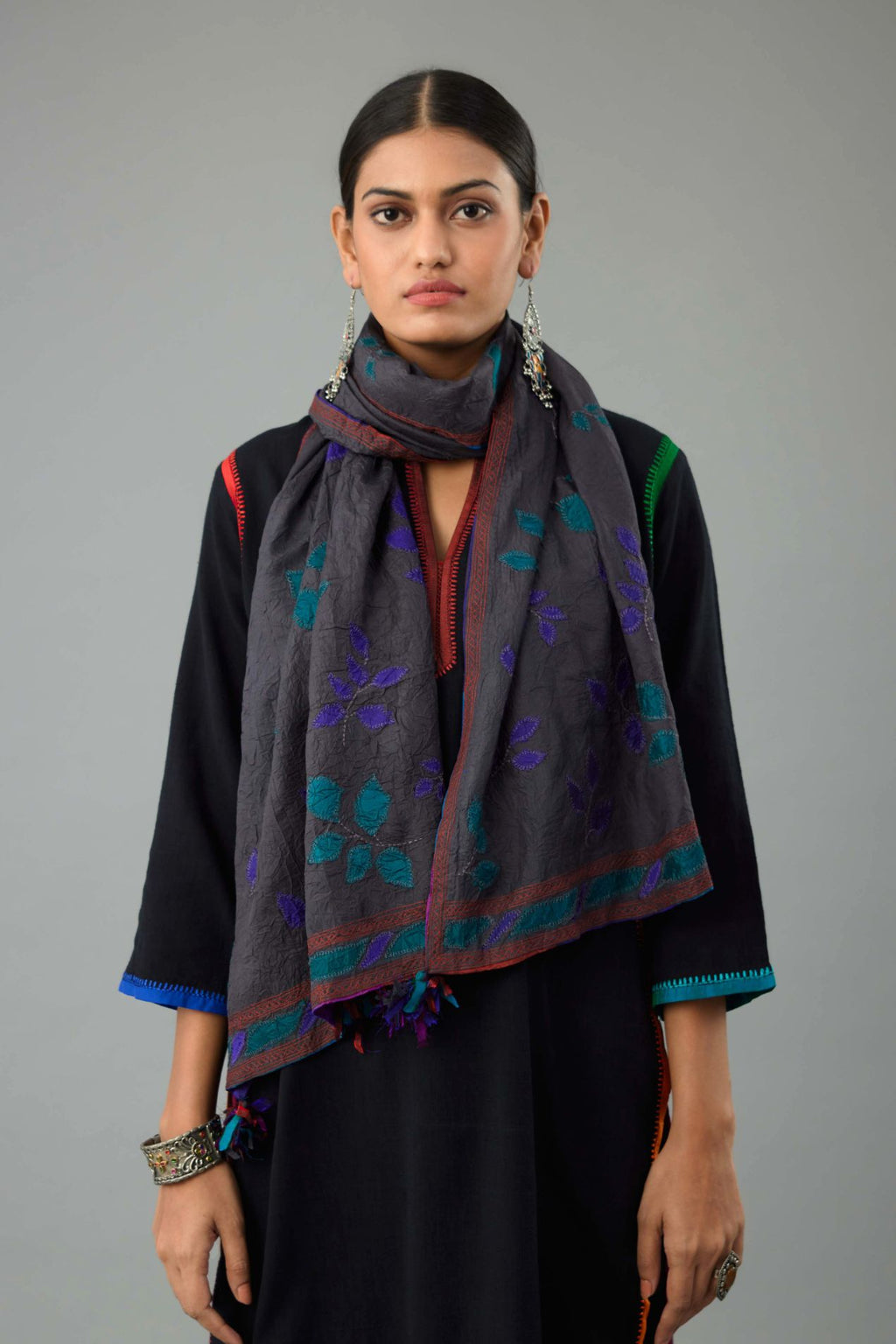Grey hand crushed silk stole with silk fabric applique work and embroidery at edges