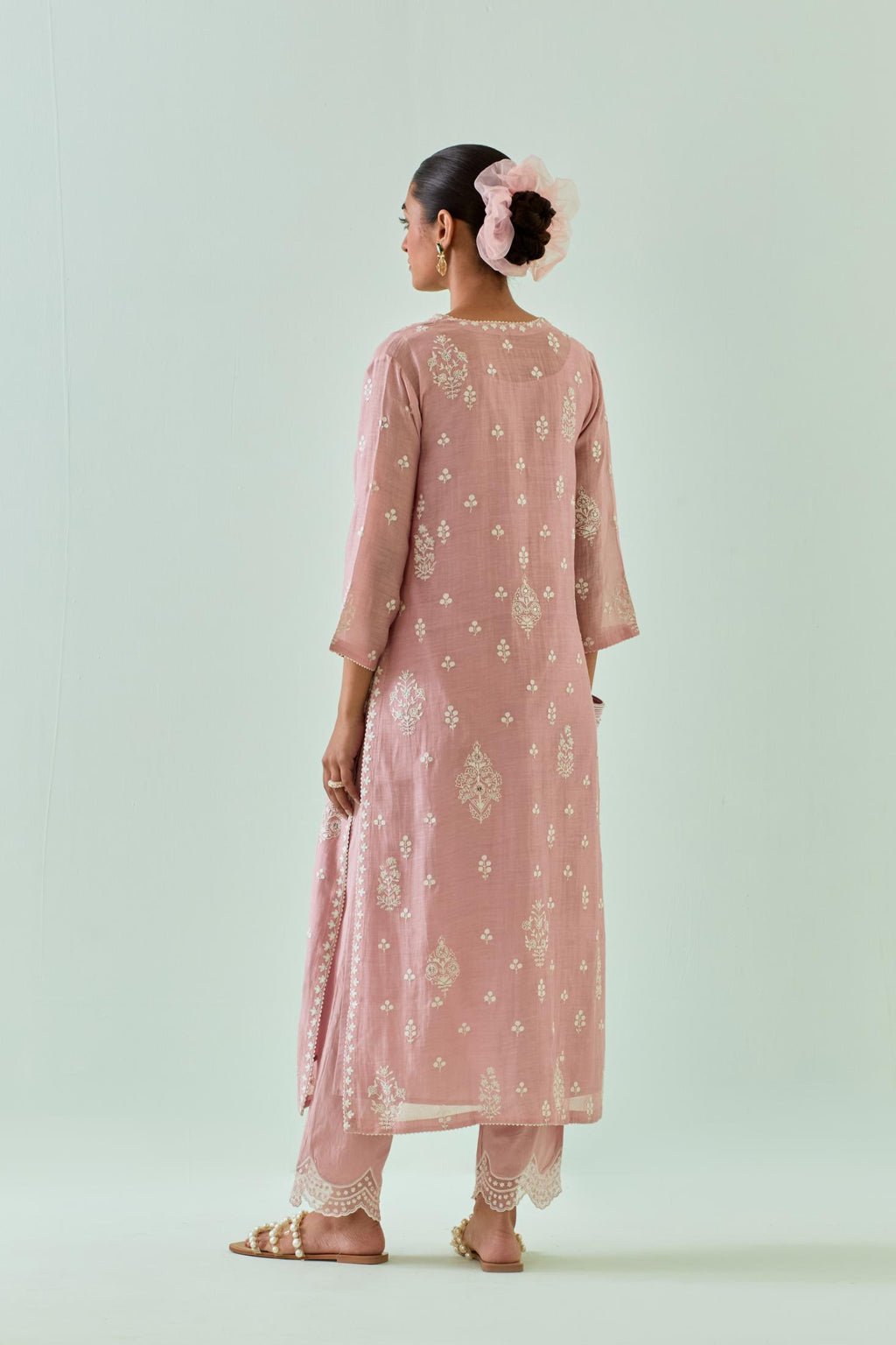 Pink straight kurta set with all-over off white Dori embroidery and highlighted with delicate beaded work.