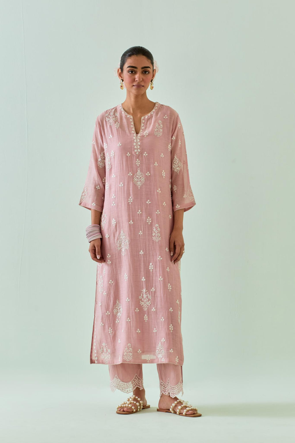 Pink straight kurta set with all-over off white Dori embroidery and highlighted with delicate beaded work.