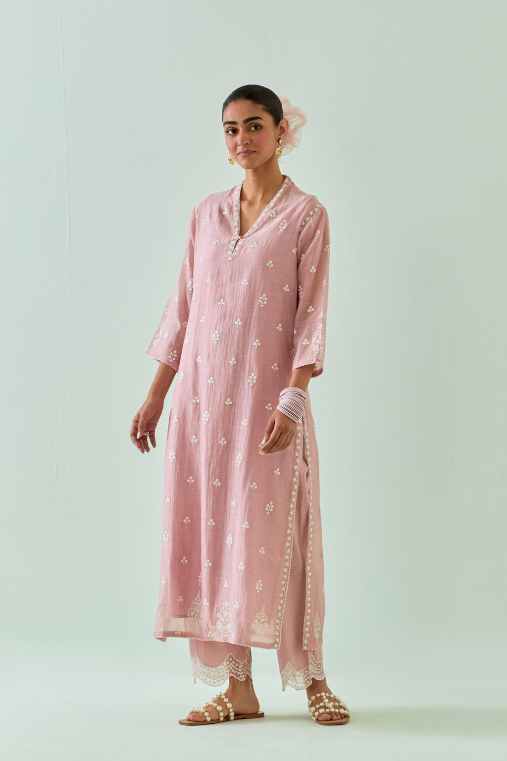 Pink straight kurta set with all-over off white Dori embroidery and highlighted with delicate beaded hand work.