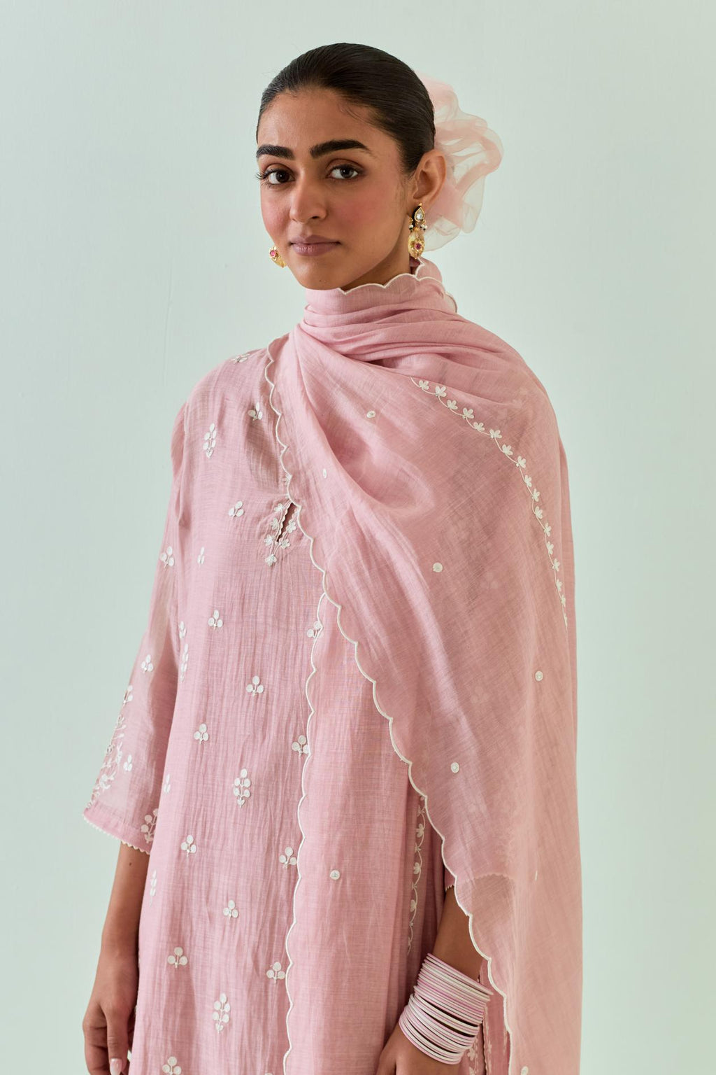 Pink straight kurta set with all-over off white Dori embroidery and highlighted with delicate beaded hand work.