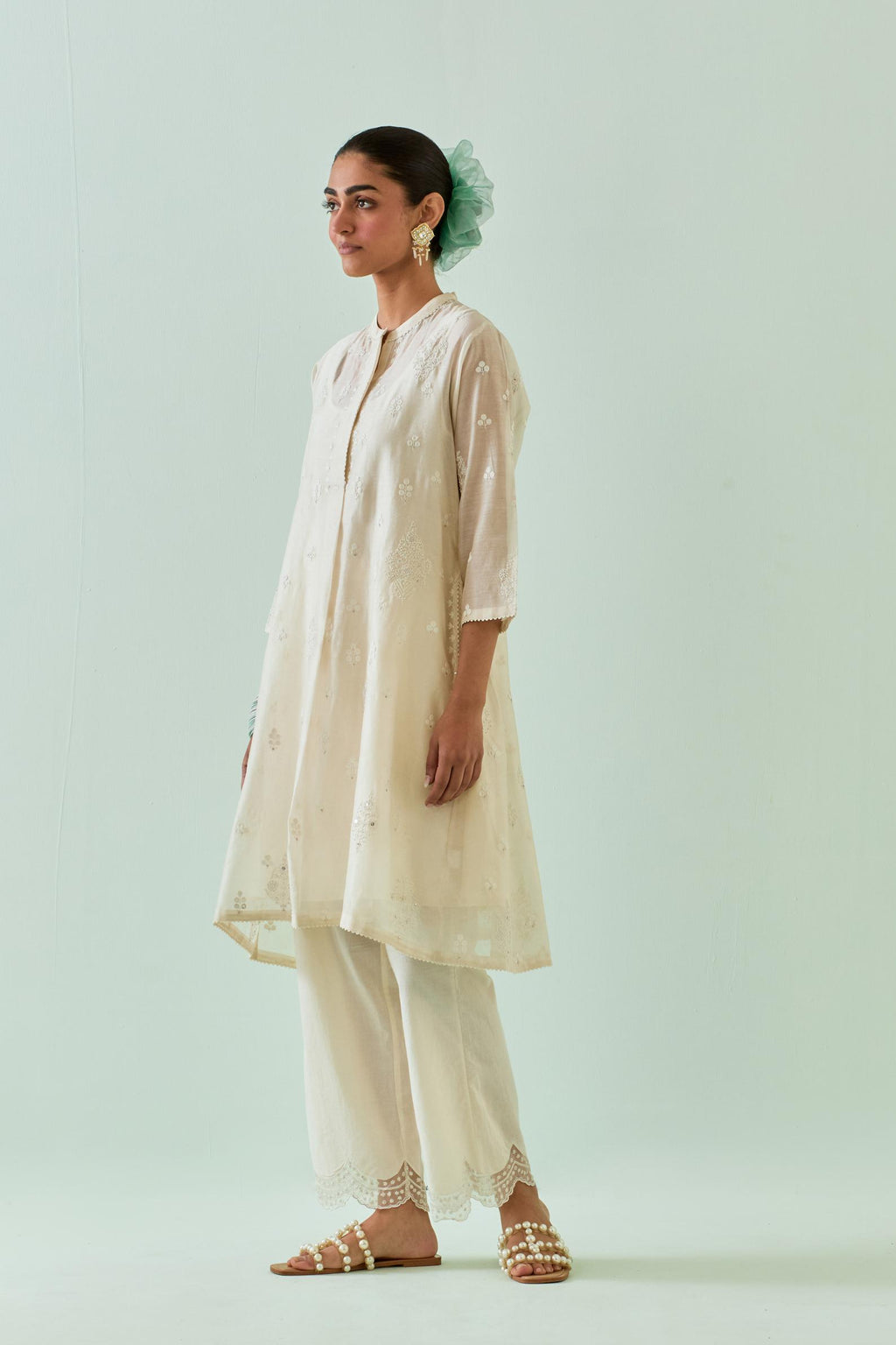 Off white short shirt-kurta set with all-over off white Dori embroidery and highlighted with delicate beaded work.