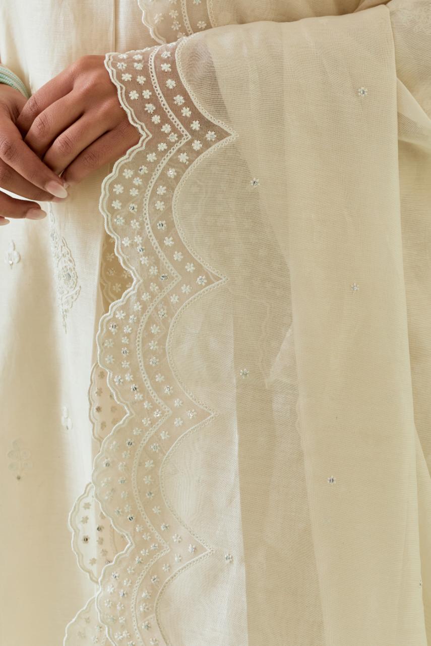 Off white short shirt-kurta set with all-over off white Dori embroidery and highlighted with delicate beaded work.