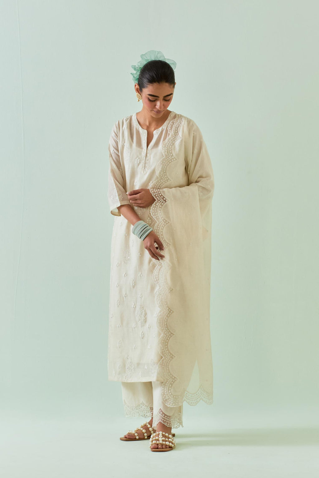 Off white straight kurta set with all-over off white Dori embroidery and highlighted with delicate beaded work.