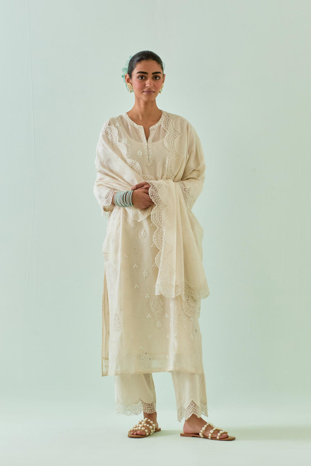 Off white straight kurta set with all-over off white Dori embroidery and highlighted with delicate beaded work.