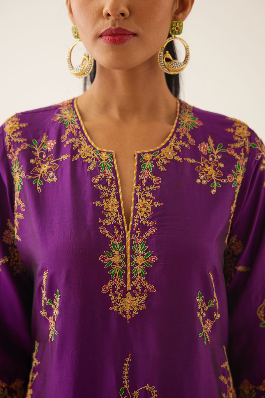 Plum purple straight silk kurta set with all over dori & silk thread embroidery highlighted with contrast bead & sequins work.