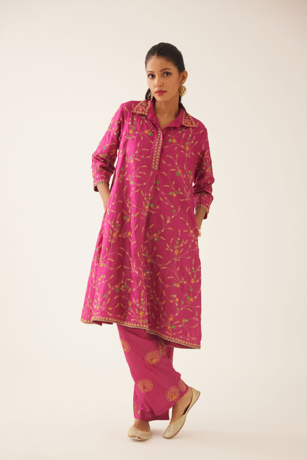 Jazz berry A-line short silk kurta set with all over embroidery, highlighted with sequins and bead work, paired with Jaz berry silk straight pants with dori and silk thread embroidery.