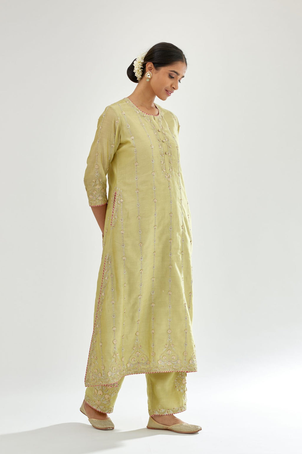 Green silk chanderi straight kurta set with all over heavy dori and gota embroidery work, highlighted with contrast bead work.