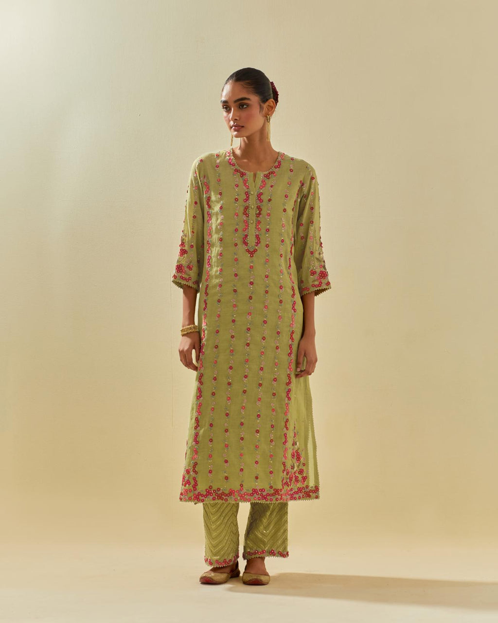 Green tissue chanderi paneled kurta set with front placket neckline and all-over hand cut silk flower embroidery.