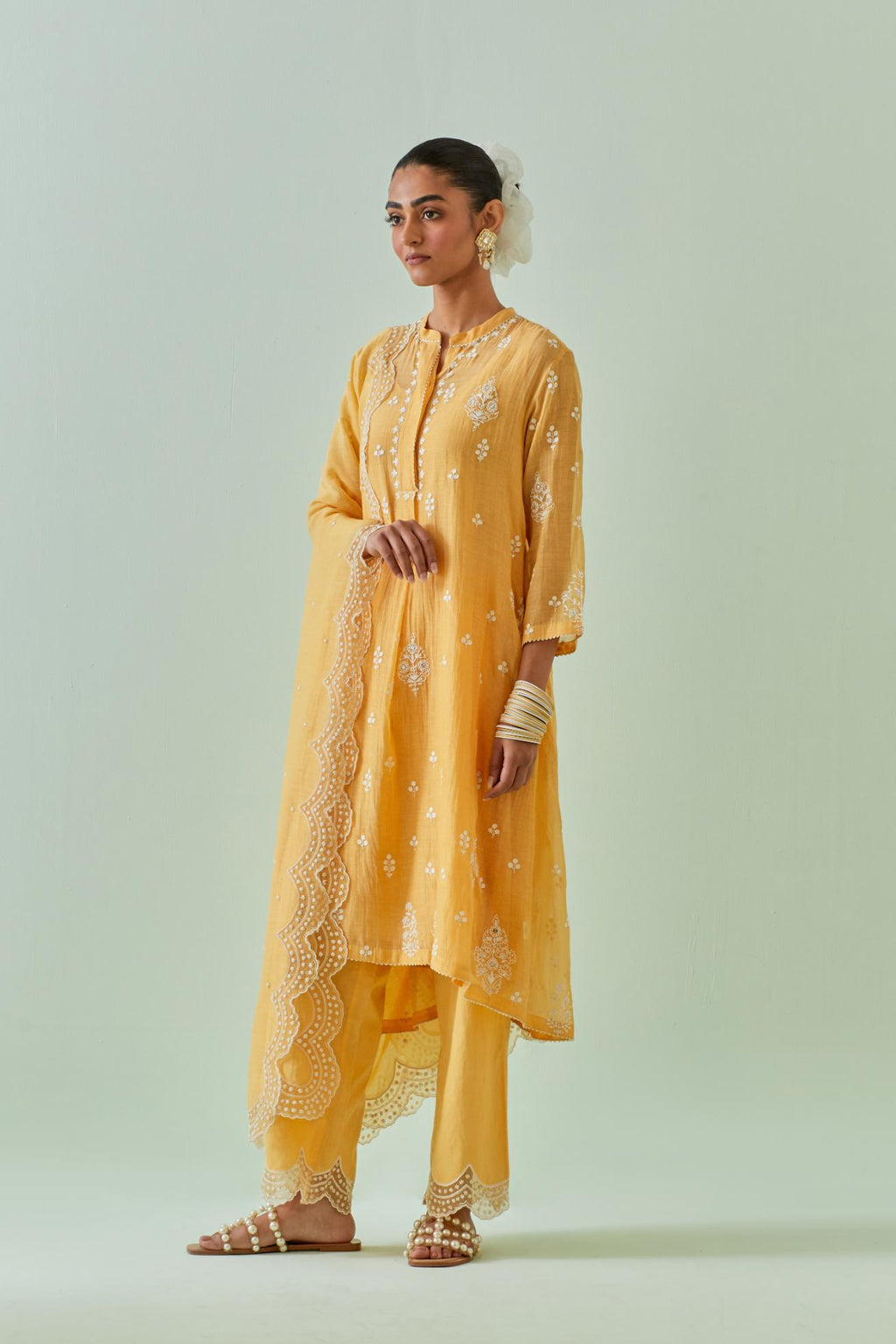 Yellow short shirt-kurta set with all-over off white Dori embroidery and highlighted with delicate beaded work.