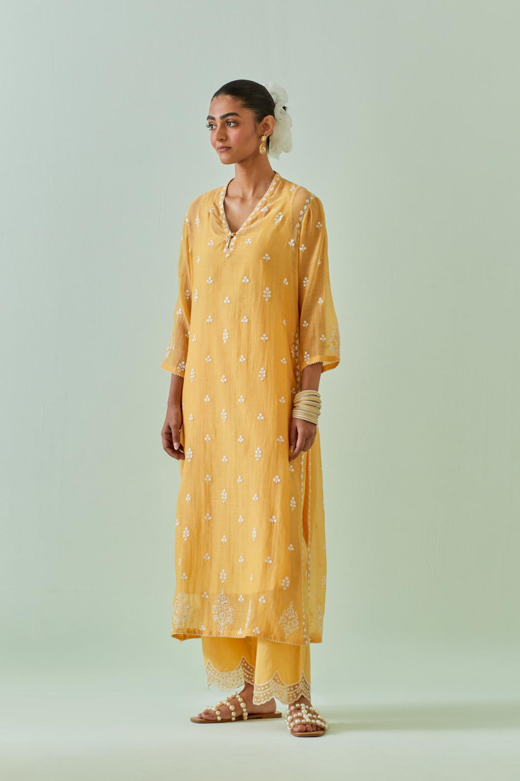 Yellow straight kurta set with all-over off white Dori embroidery and highlighted with delicate beaded hand work.