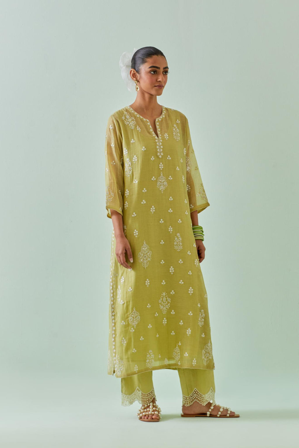 Green straight kurta set with all-over off white Dori embroidery and highlighted with delicate beaded work.