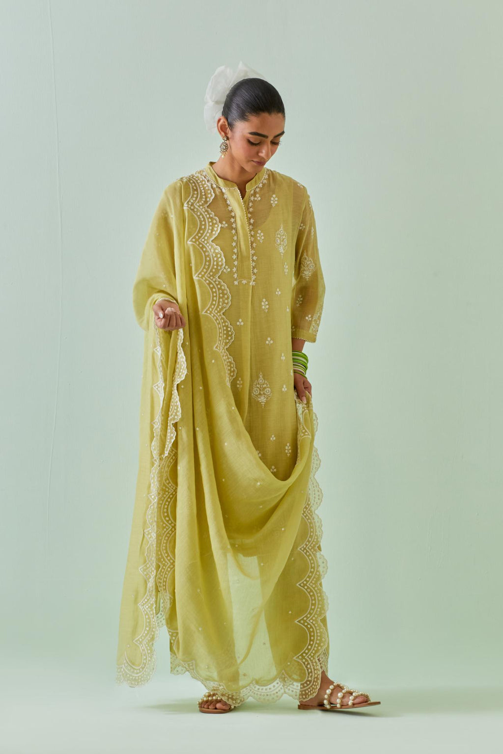Green short shirt-kurta set with all-over off white Dori embroidery and highlighted with delicate beaded work.