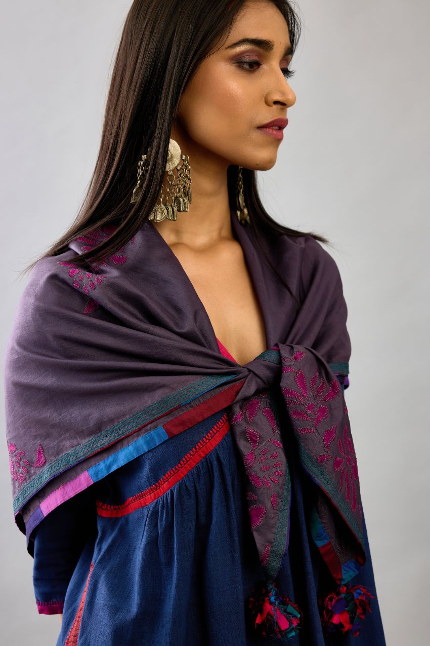 Grey silk square scarf with silk fabric applique work and embroidery at edges.