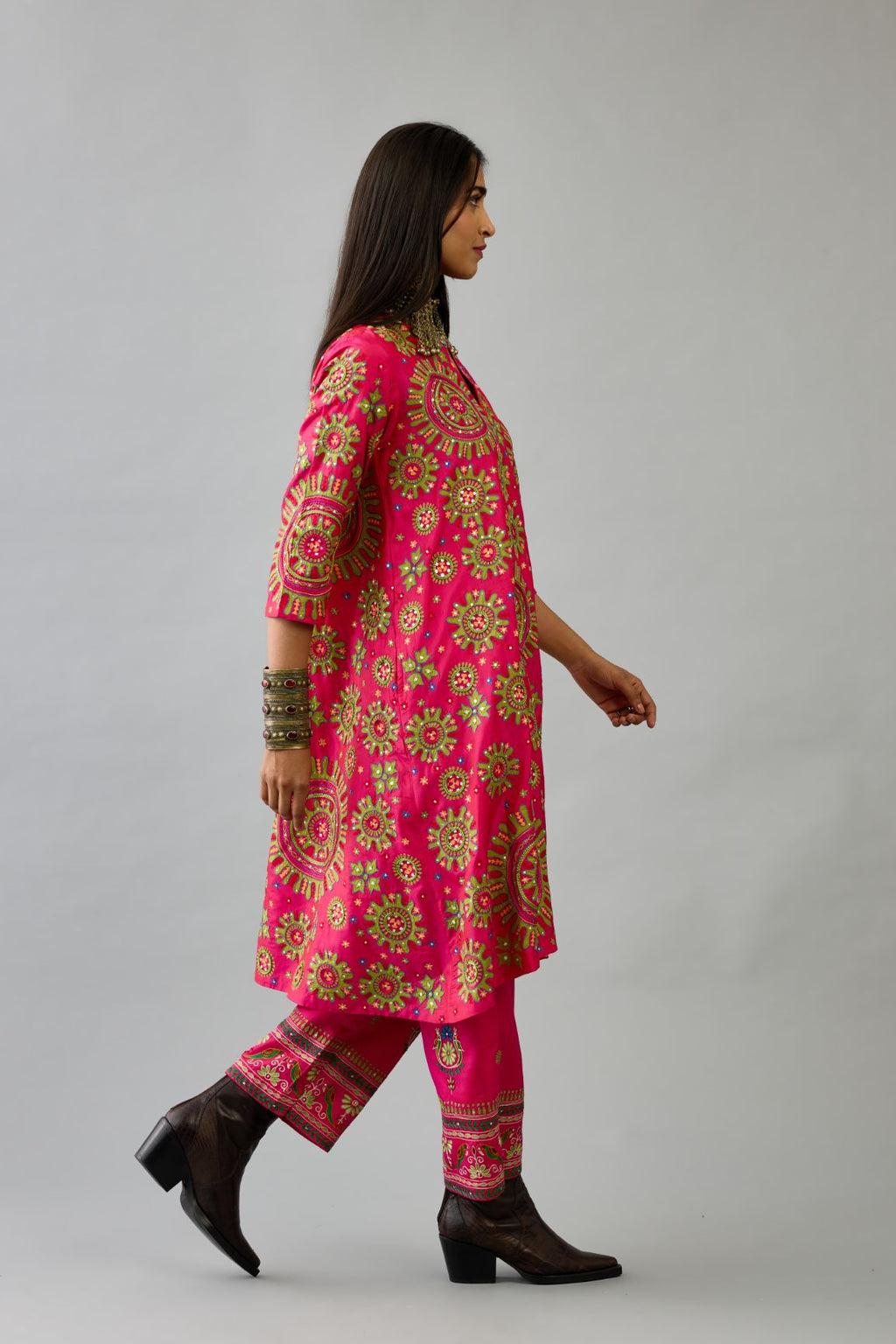 Fuchsia A-line silk kurta set with all over patchwork, silk thread, mirror, tassels and sequin embroidery.