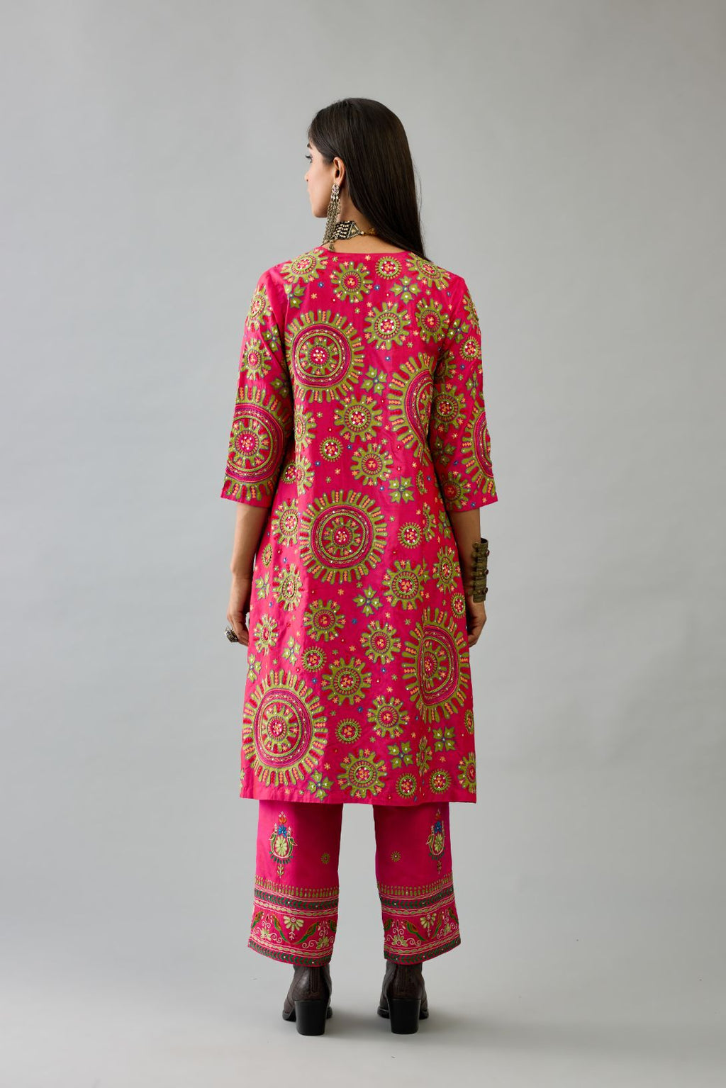 Fuchsia A-line silk kurta set with all over patchwork, silk thread, mirror, tassels and sequin embroidery.