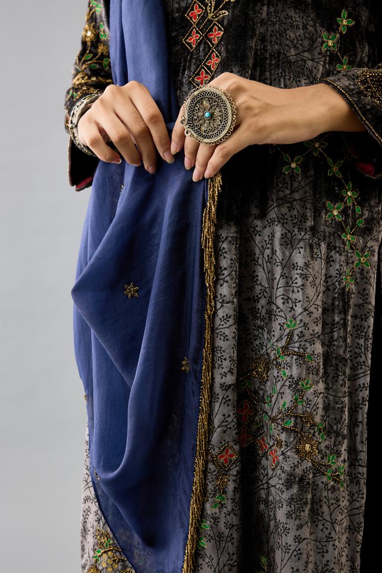 Blue light silk stole with all-over small embroidered booti and fringes at sides.