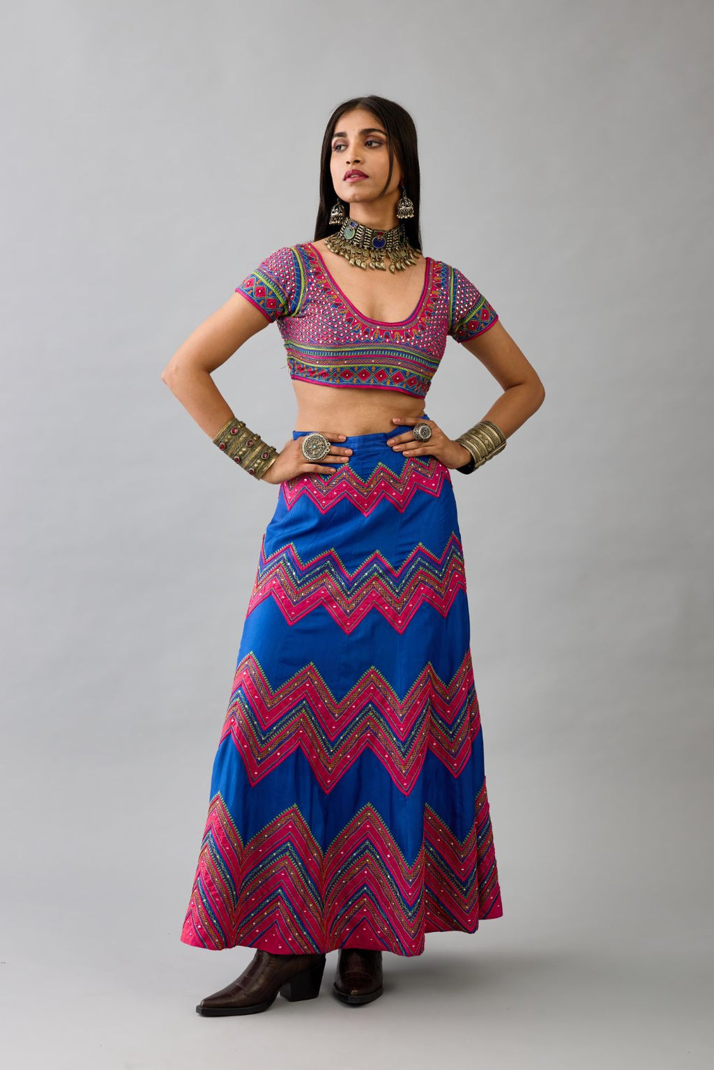 Blue silk embroidered choli set with deep round neck and princess seams.