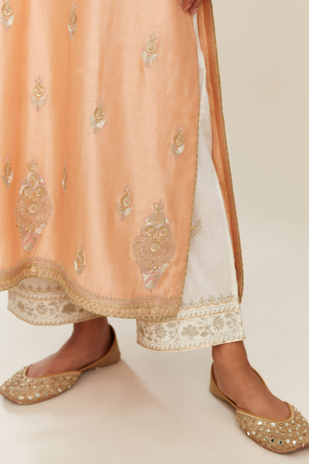 Peach silk chanderi straight kurta set with gold gota and zari embroidery.