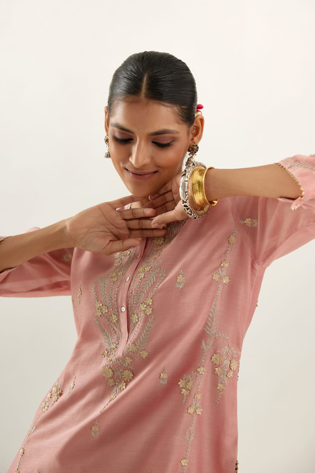 Pink silk chanderi straight kurta set with button placket neckline, highlighted with all-over gold gota and zari embroidery.