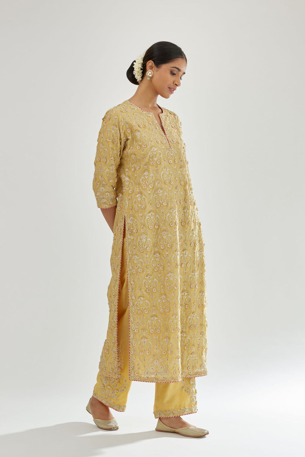 Yellow silk chanderi straight kurta set with all-over dori and gota jaal embroidery, highlighted with contrast bead work.