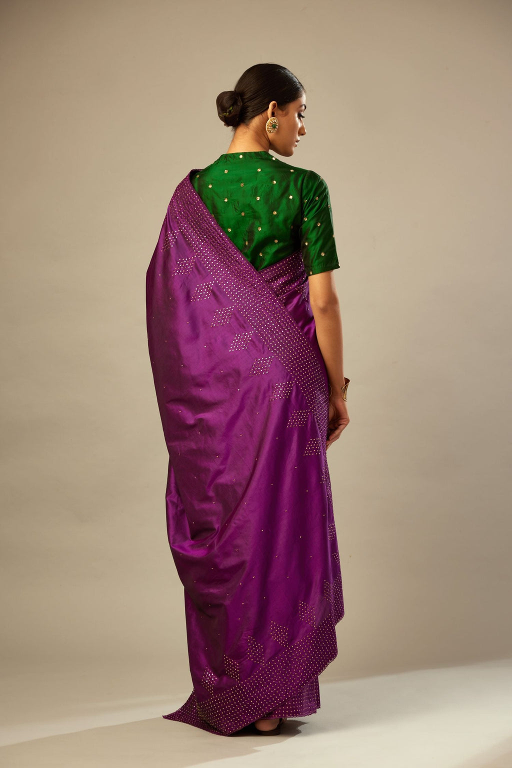 Plum purple silk saree set with a broad sequin border with diamond motifs.