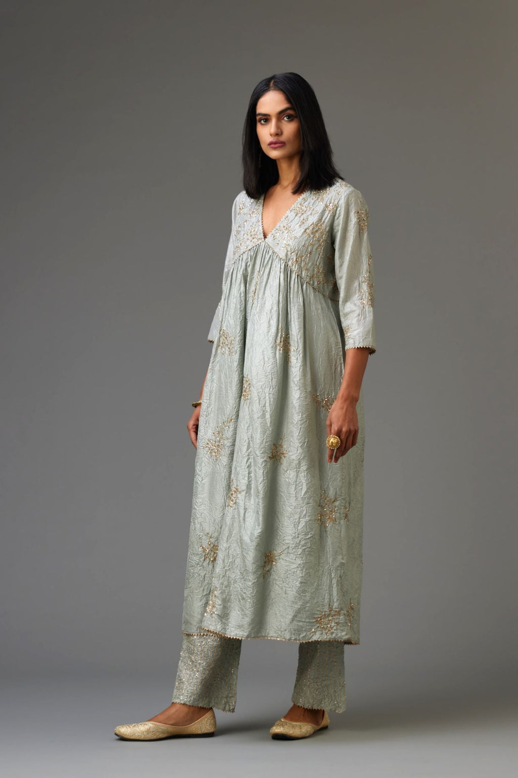Blue silk hand crushed V neck gathered kurta, highlighted with all-over gold sequins boota.