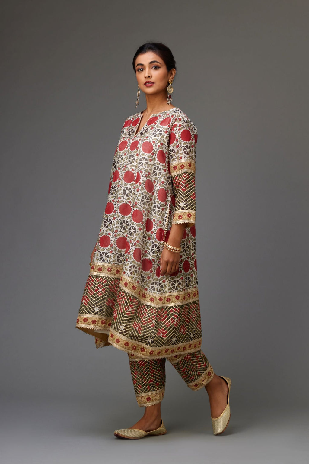 Red and off white hand block printed short A-line kurta, detailed with gold gota and flowers.