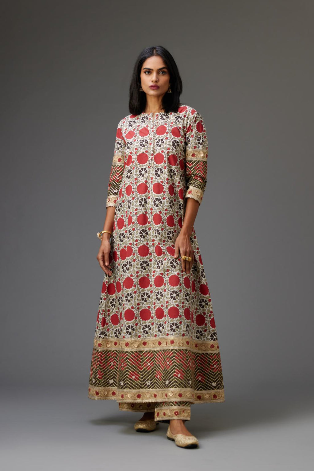 Hand block printed A-line cotton straight kurta with gota detailing, paired with red and green cotton hand block printed straight pants detailed with gota at the border.