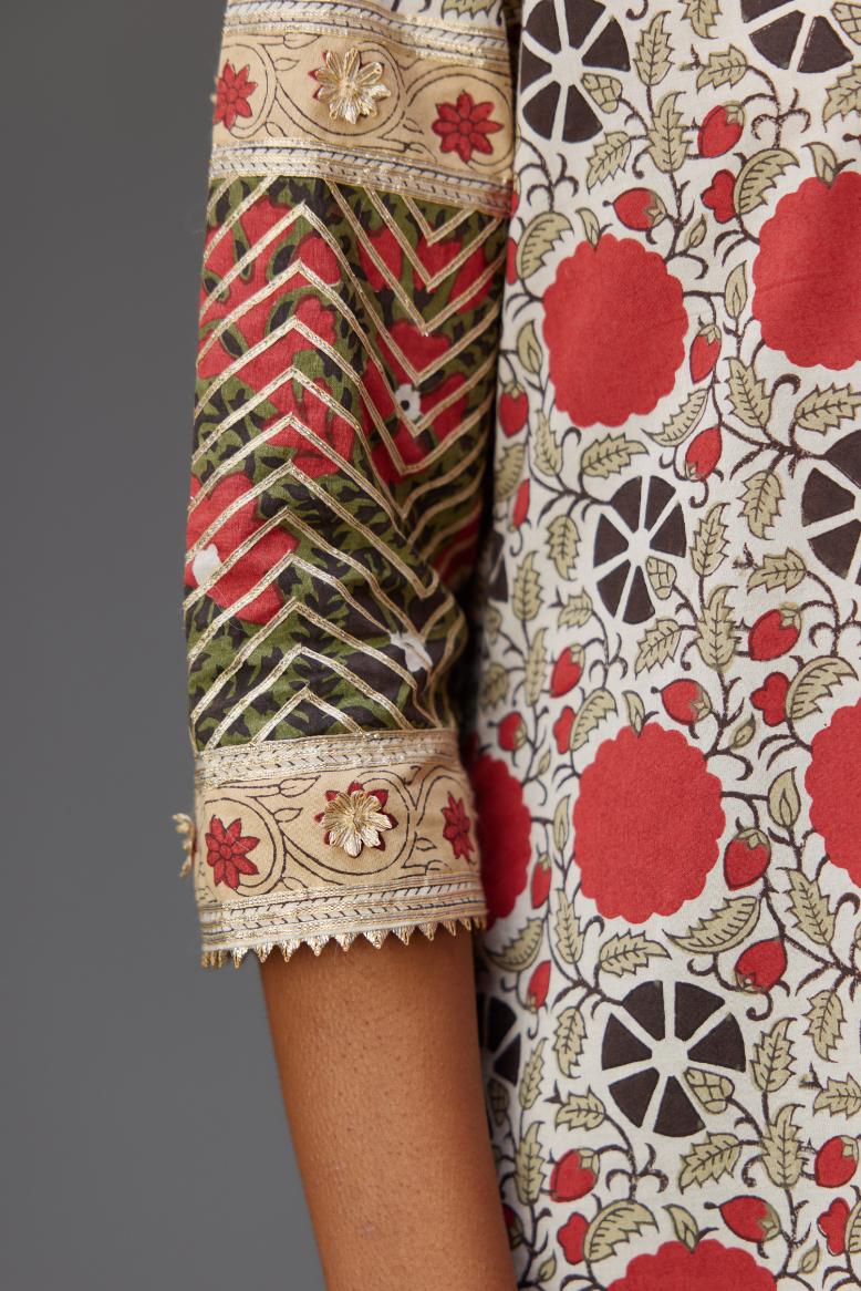 Hand block printed A-line cotton straight kurta with gota detailing, paired with red and green cotton hand block printed straight pants detailed with gota at the border.