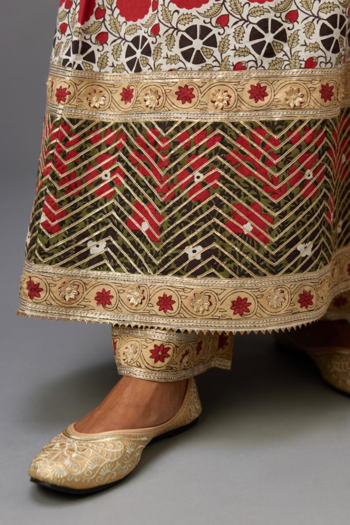 Hand block printed A-line cotton straight kurta with gota detailing, paired with red and green cotton hand block printed straight pants detailed with gota at the border.