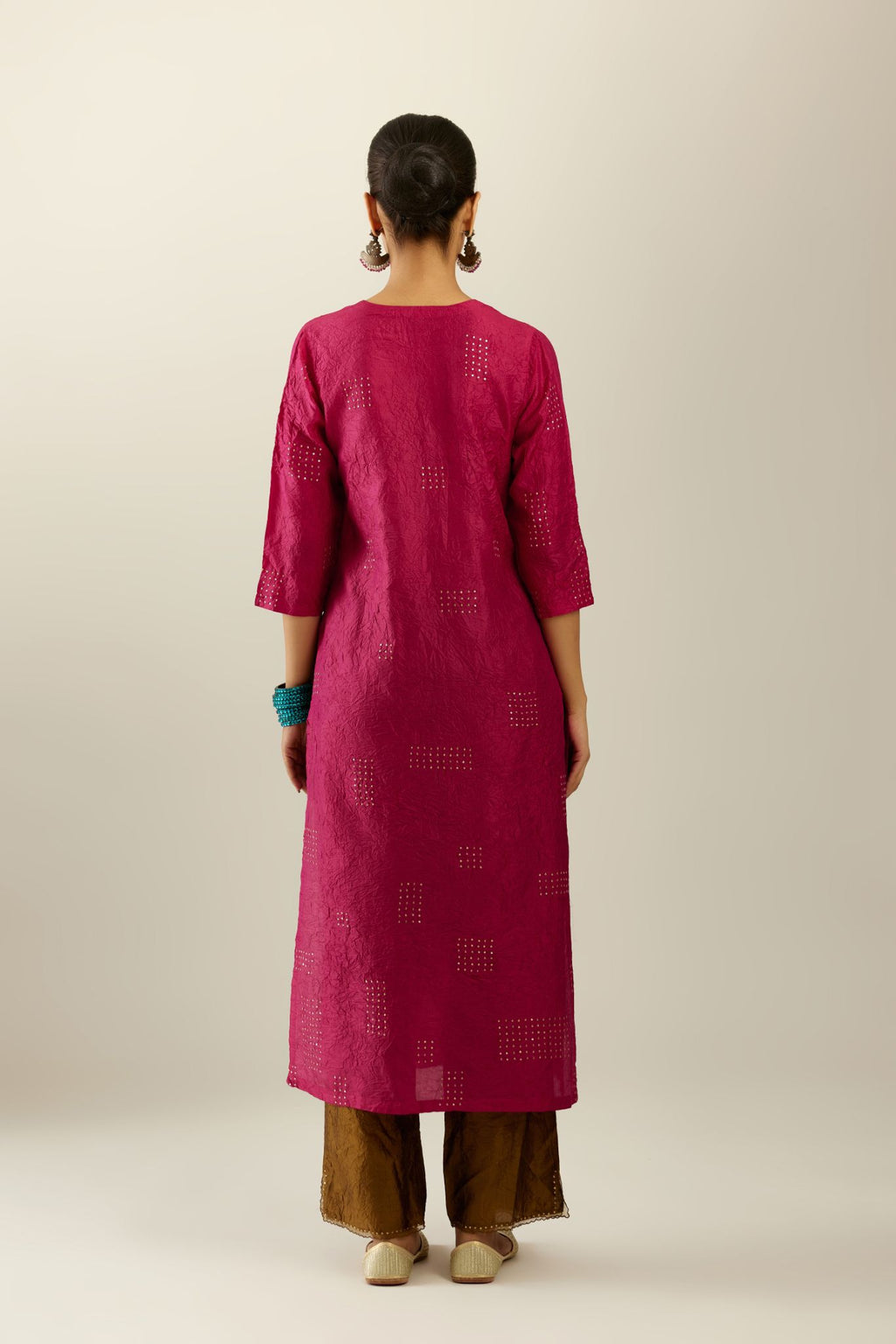 Jazzberry jam hand crushed silk straight kurta, highlighted with all-over gold sequins rectangles, paired with  golden olive hand crushed silk straight pants with scalloped and embroidered organza at edges.