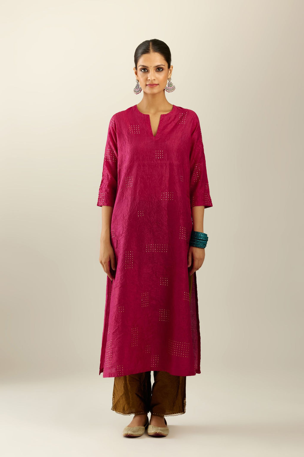 Jazzberry jam hand crushed silk straight kurta, highlighted with all-over gold sequins rectangles, paired with  golden olive hand crushed silk straight pants with scalloped and embroidered organza at edges.