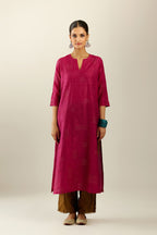 Jazzberry jam hand crushed silk straight kurta, highlighted with all-over gold sequins rectangles, paired with  golden olive hand crushed silk straight pants with scalloped and embroidered organza at edges.