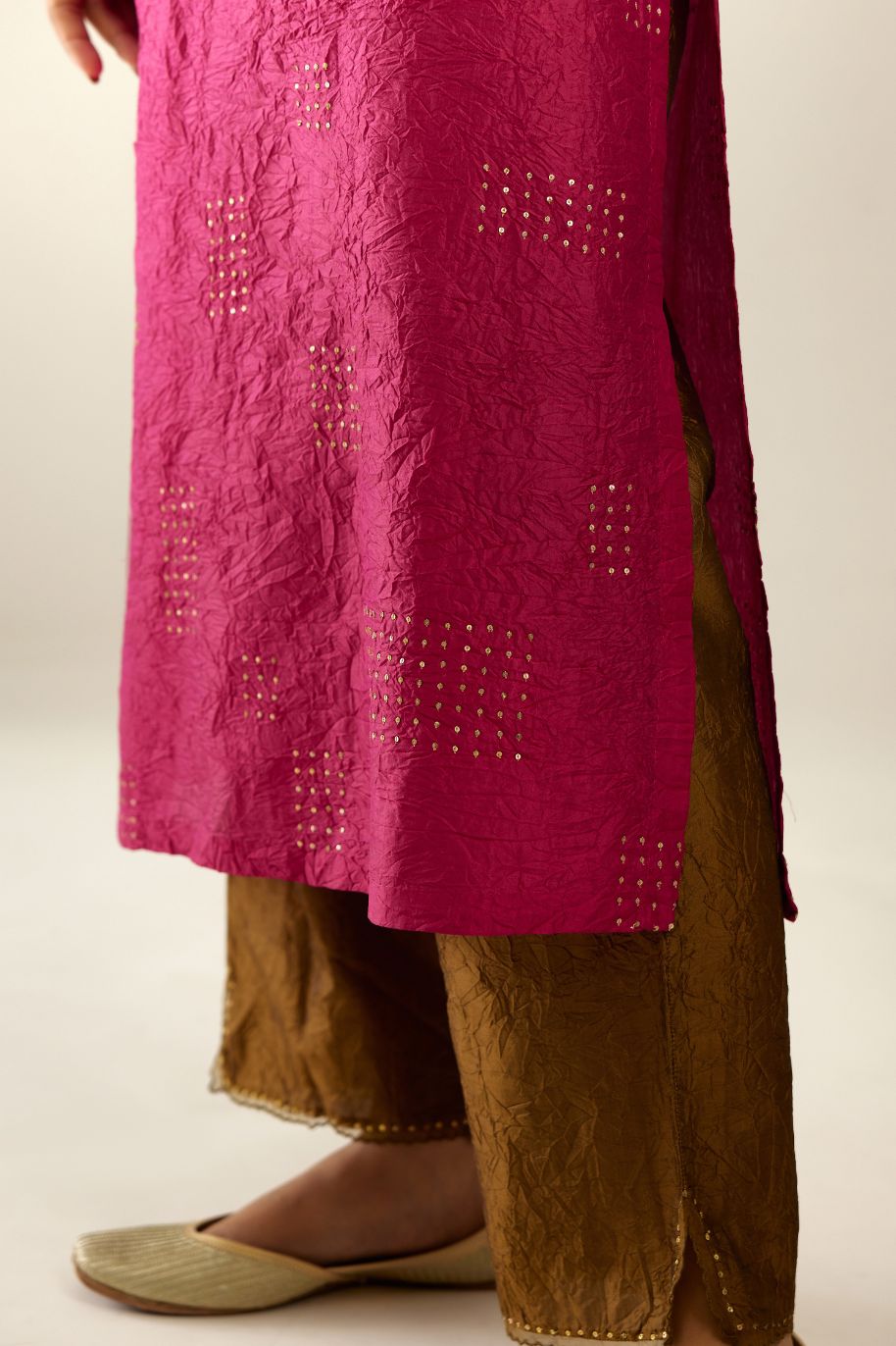 Jazzberry jam hand crushed silk straight kurta, highlighted with all-over gold sequins rectangles, paired with  golden olive hand crushed silk straight pants with scalloped and embroidered organza at edges.