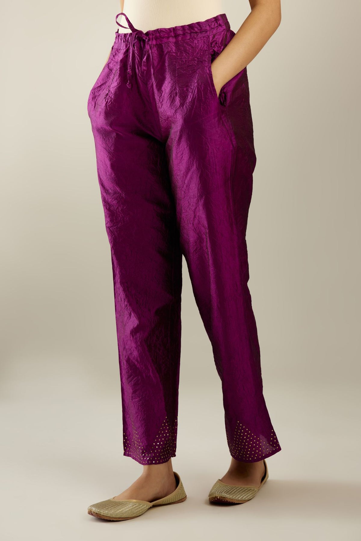 Sangria hand crushed pure silk straight pants with gold sequins work at hem and side pockets.