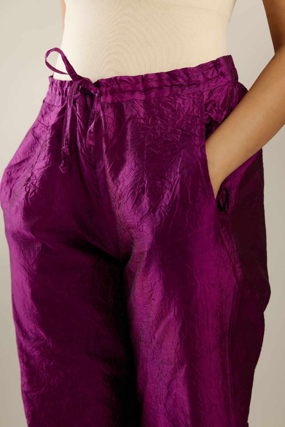 Sangria hand crushed pure silk straight pants with gold sequins work at hem and side pockets.