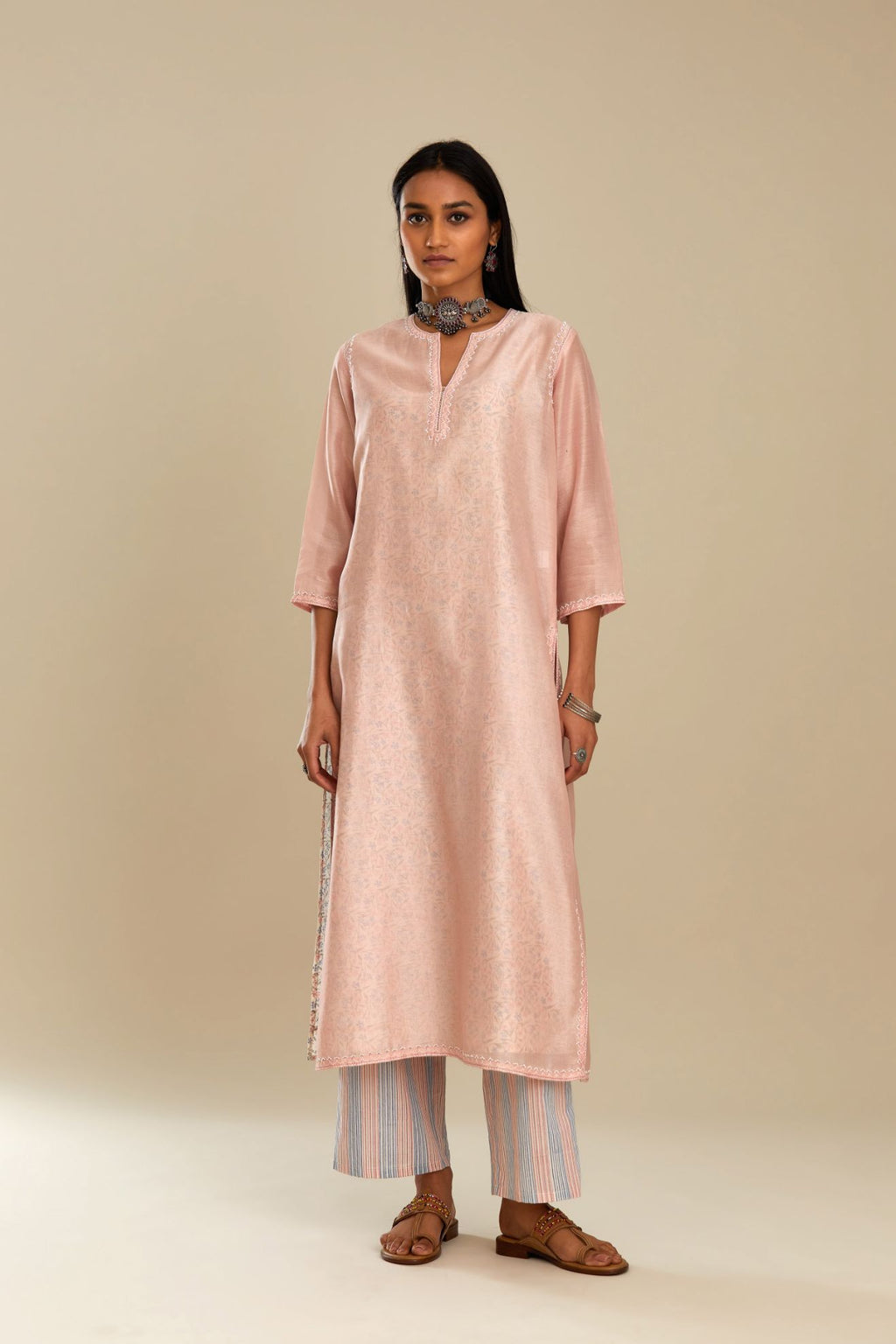 Silk chanderi straight kurta with hand block printed cotton slip inside.