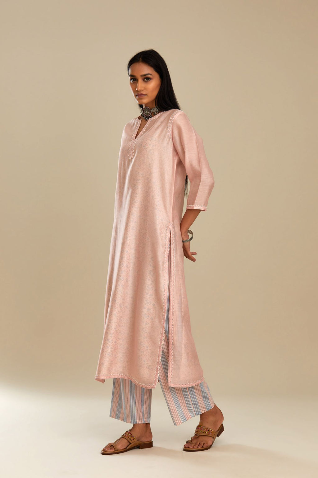 Silk chanderi straight kurta with hand block printed cotton slip inside.