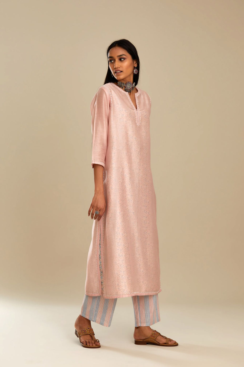 Silk chanderi straight kurta with hand block printed cotton slip inside.