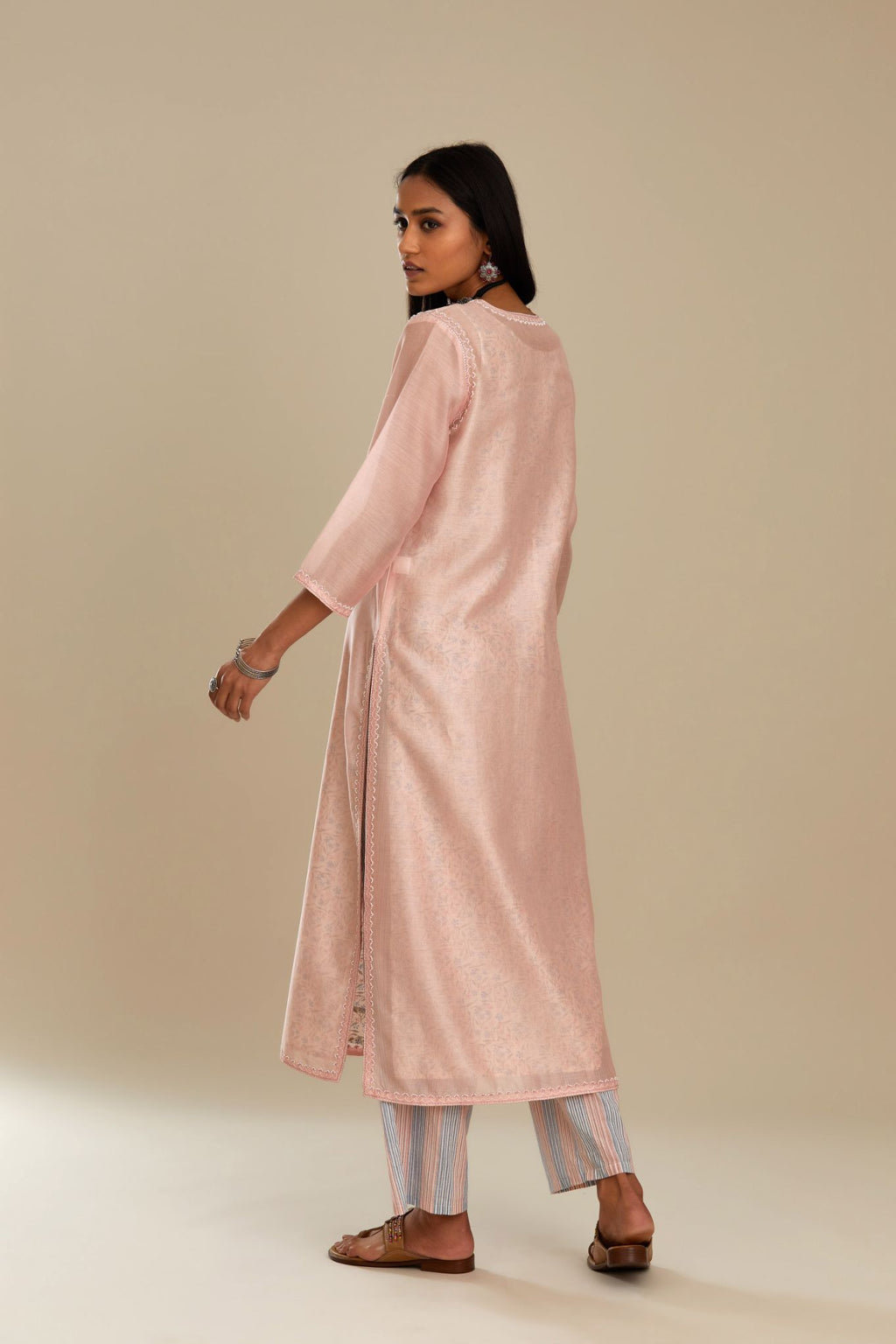 Silk chanderi straight kurta with hand block printed cotton slip inside.