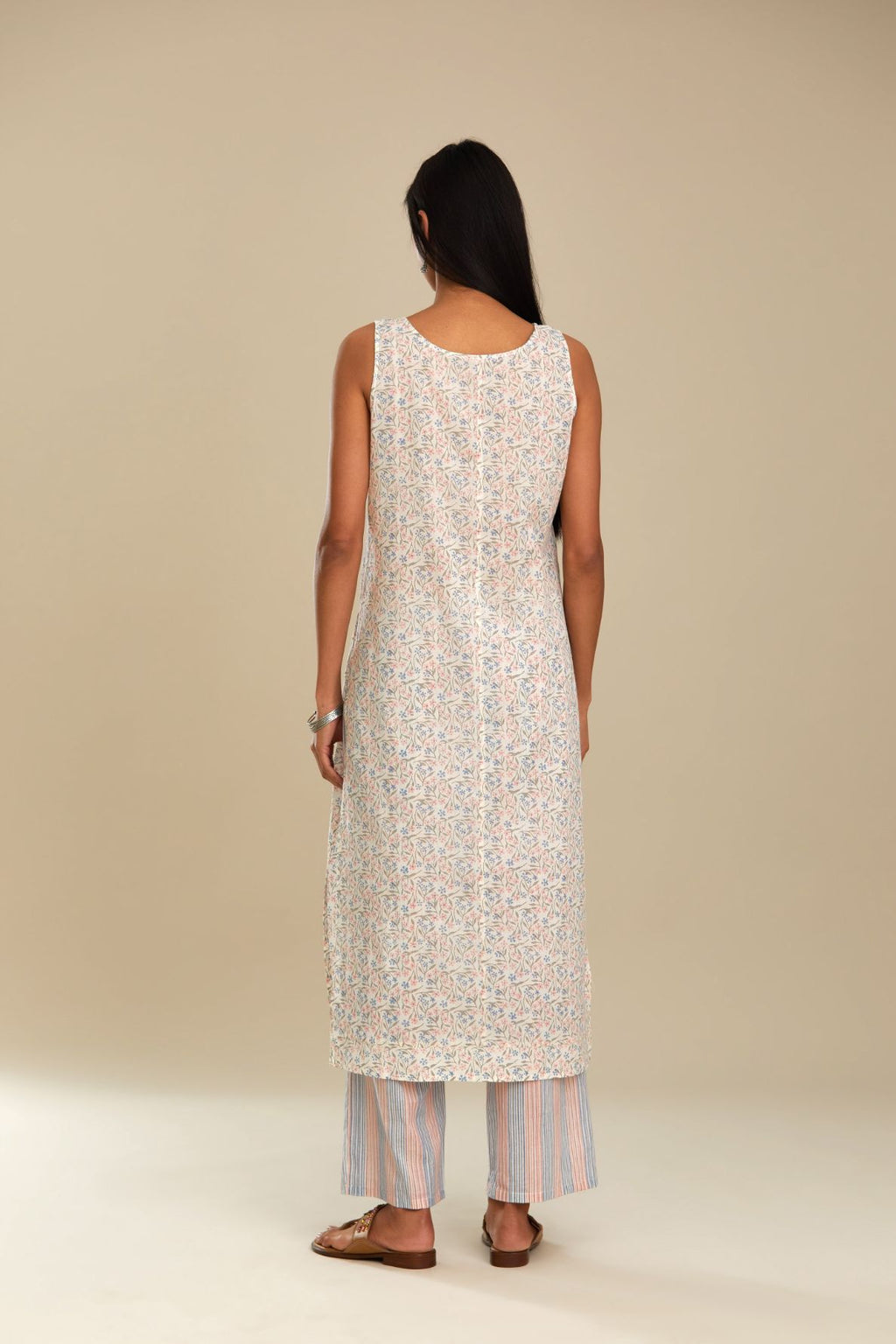 Silk chanderi straight kurta with hand block printed cotton slip inside.