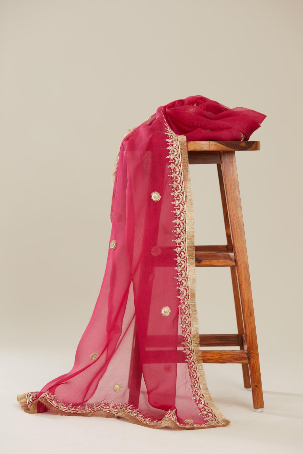 Fuchsia silk organza dupatta with delicate gold zari and gota embroidery border running along all edges.