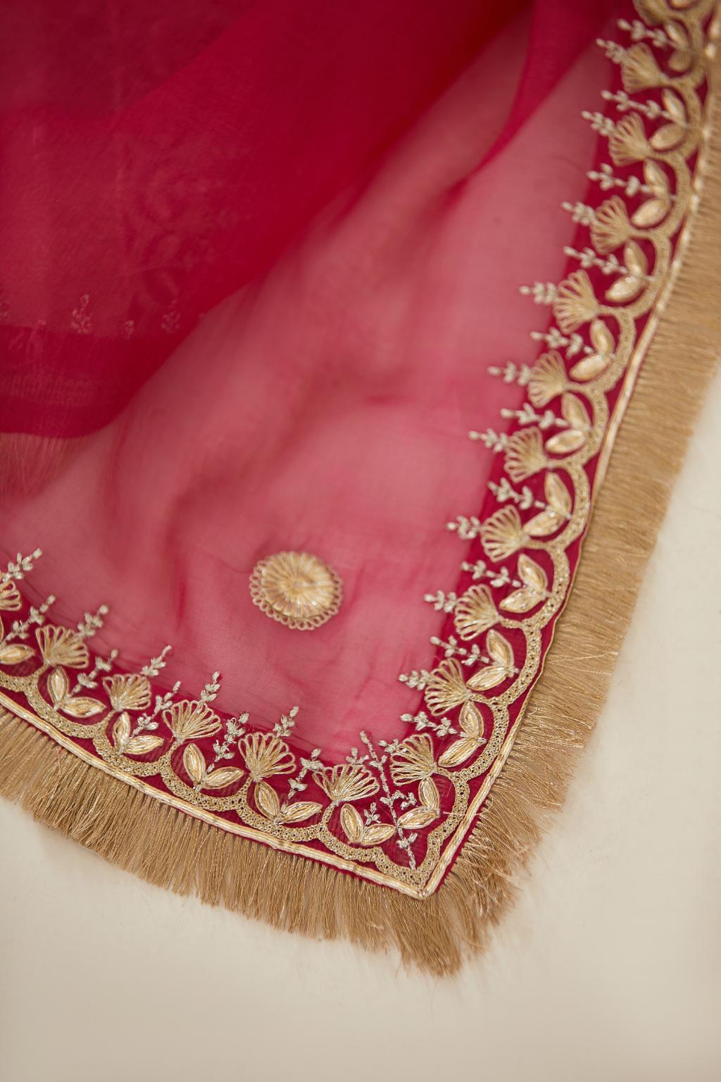 Fuchsia silk organza dupatta with delicate gold zari and gota embroidery border running along all edges.