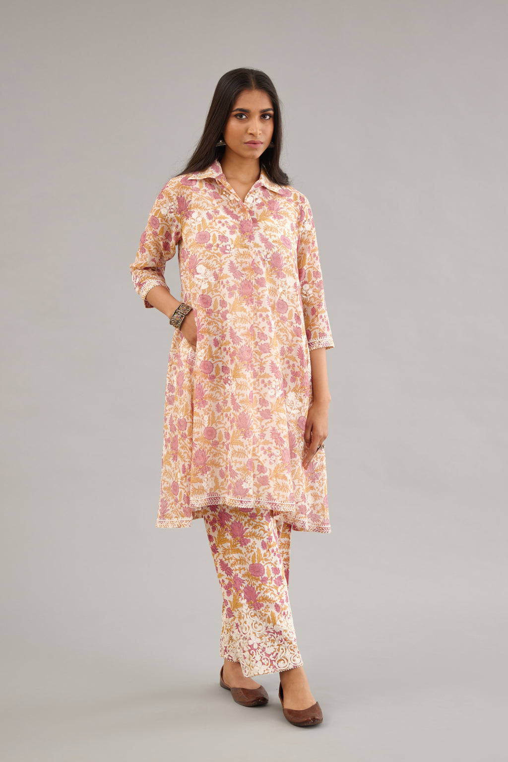 Pink and mustard hand block printed short kurta, paired with paired with pink & mustard hand block printed cotton pants with dori embroidery at hem detailed with sequins work