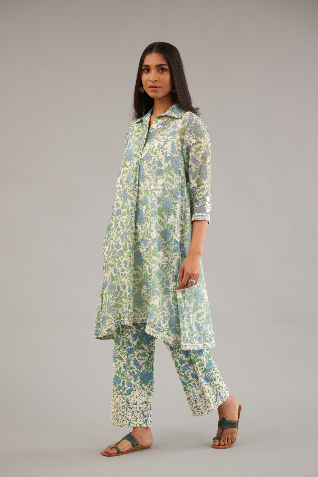 Blue & green hand block printed short kurta, paired with blue & green hand block printed cotton pants with dori embroidery at hem detailed with sequins work