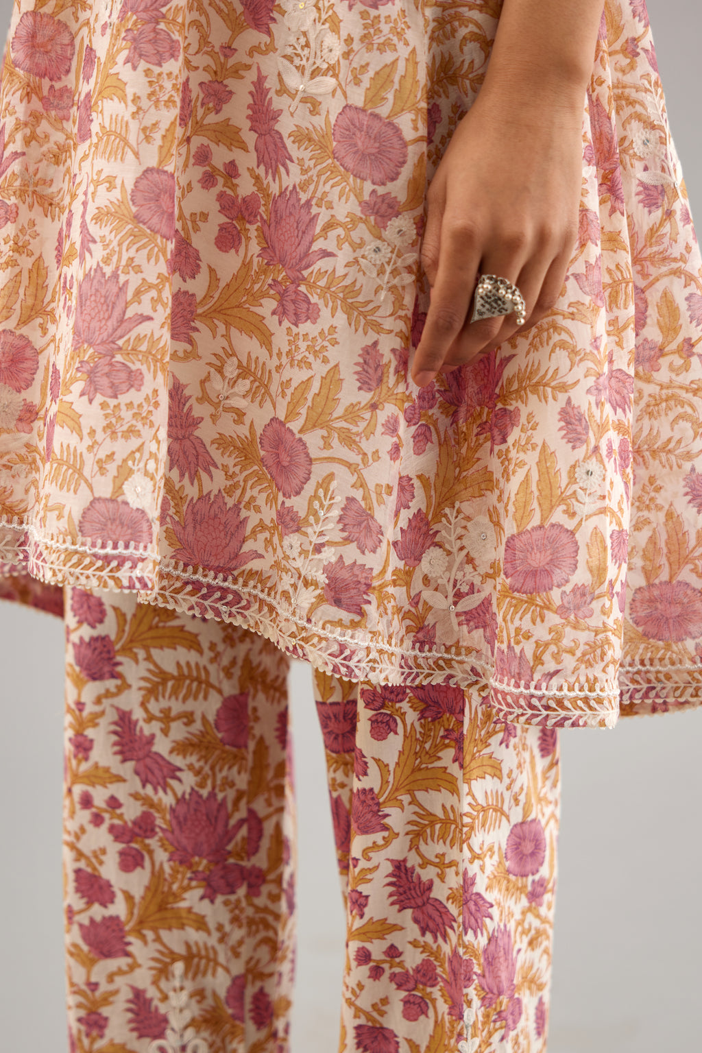 Pink and mustard hand block printed short kurta, paired with paired with pink & mustard hand block printed cotton pants with dori embroidery at hem detailed with sequins work